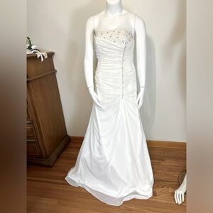 Vintage corset back strapless wedding gown.